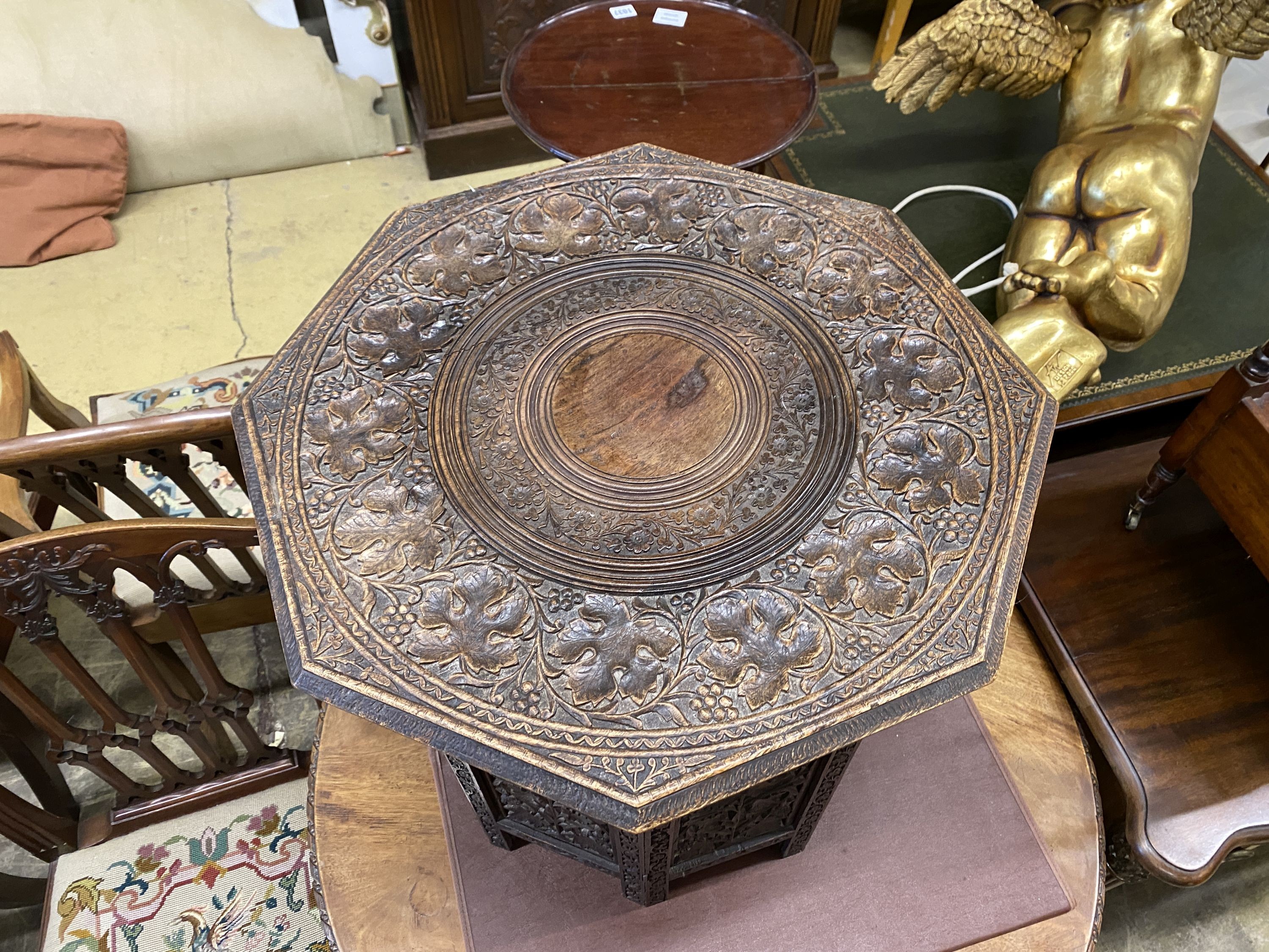 An Indian carved hardwood octagonal occasional table, width 53cm, height 55cm